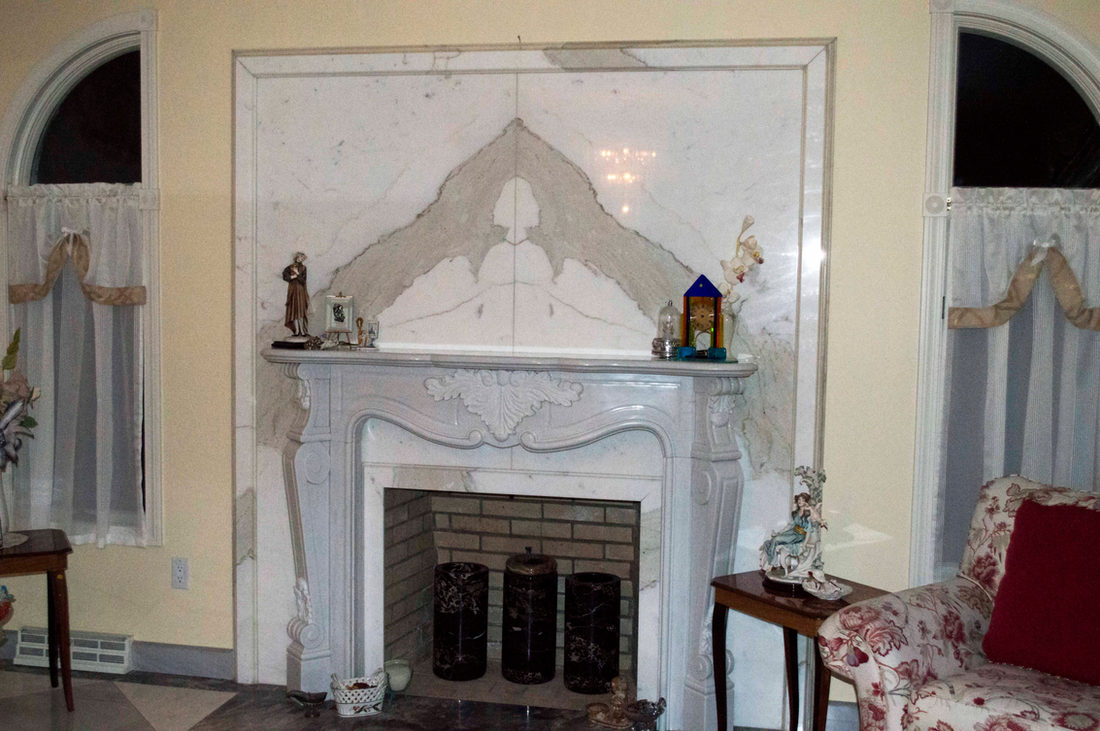 Fireplace surround by Pistritto Marble — ornate white stone surround