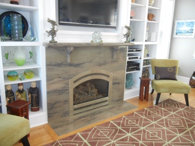 Fireplace surround by Pistritto Marble — arched stone surround with built-ins