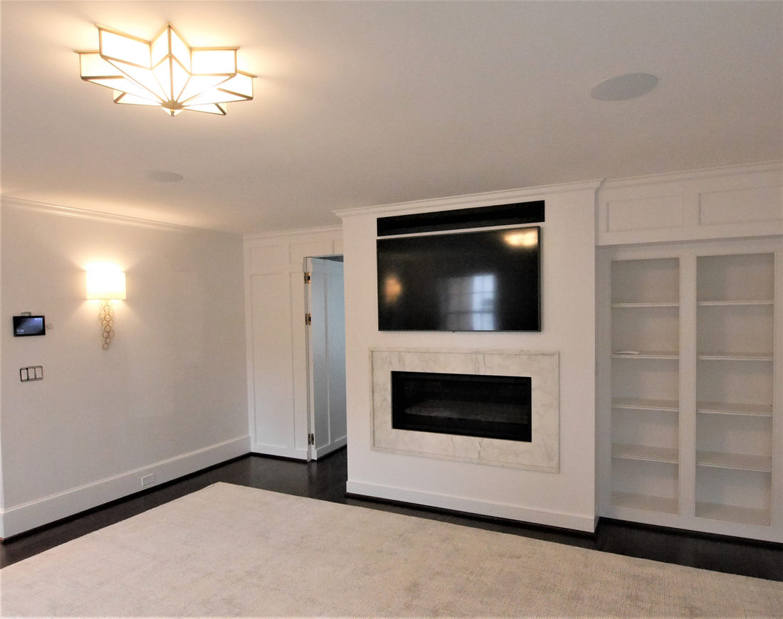 Fireplace surround by Pistritto Marble — media wall with stone fireplace surround