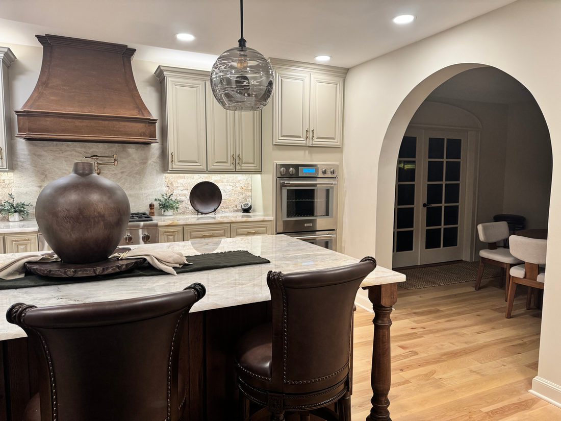 Kitchen countertop project by Pistritto Marble — island with dark leather seating