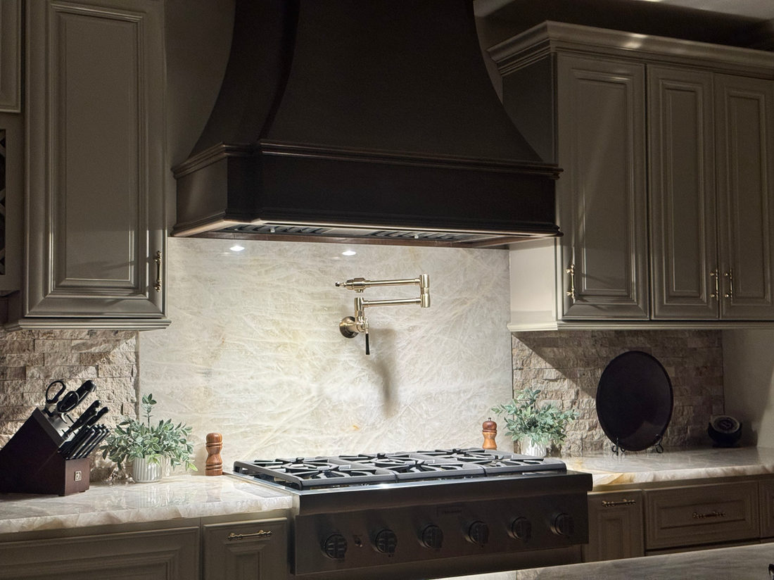 Kitchen countertop project by Pistritto Marble — stone slab backsplash behind the range