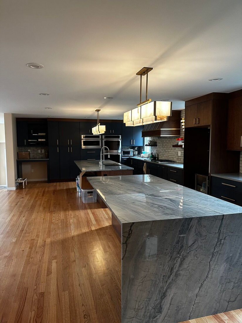 Kitchen countertop project by Pistritto Marble — waterfall-edge quartzite islands in an open kitchen