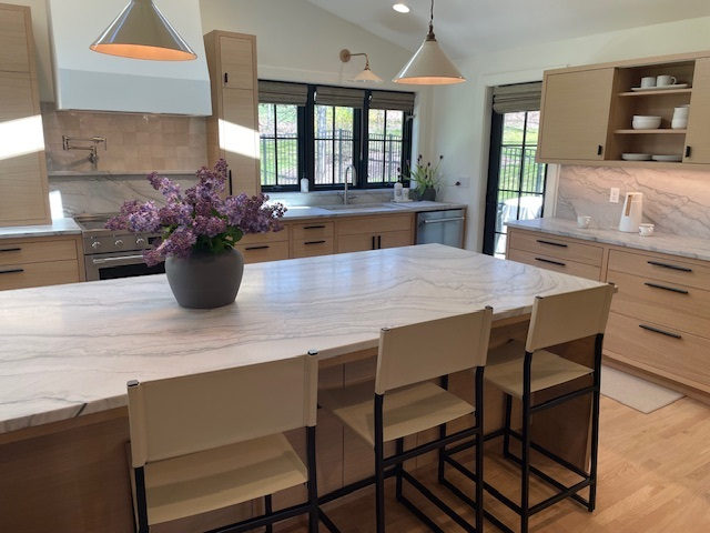 Kitchen countertop project by Pistritto Marble — bright kitchen island with bar seating