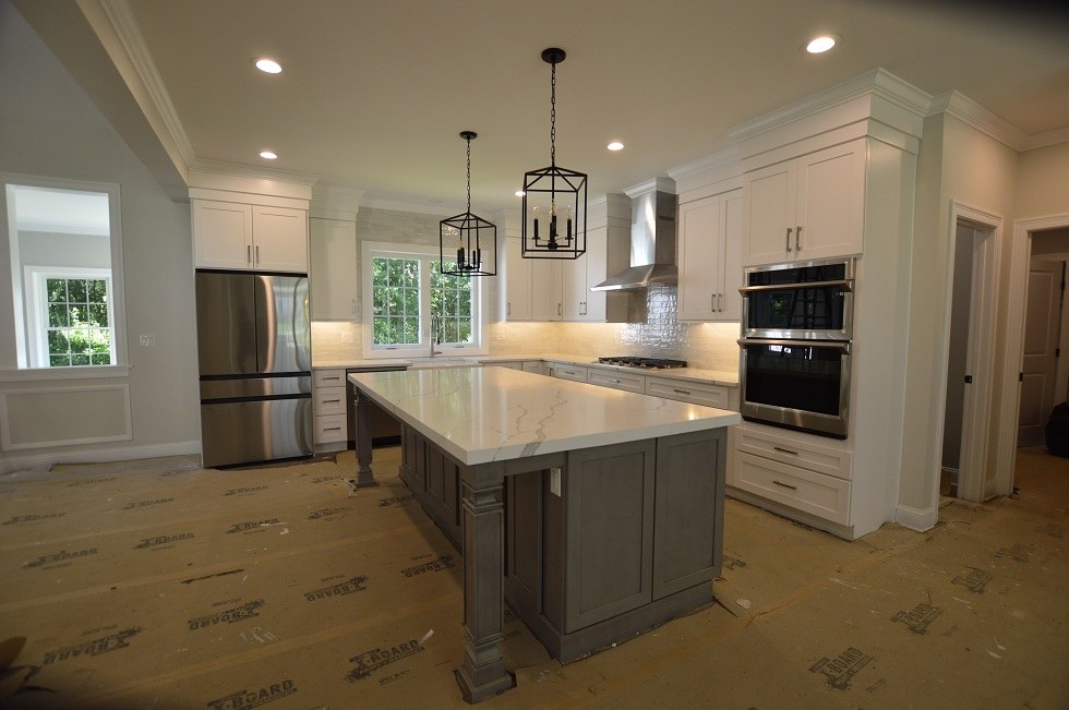 Kitchen countertop project by Pistritto Marble — Calacatta Laza quartz island with grey cabinetry