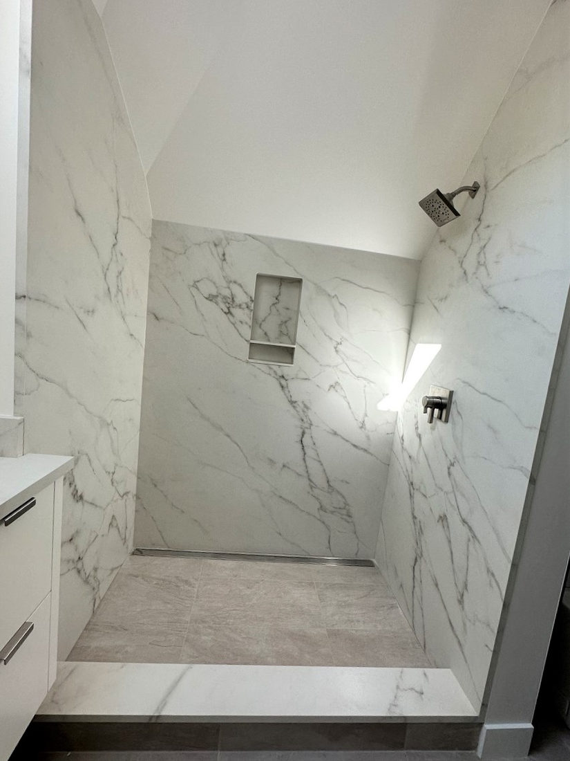 Bath project by Pistritto Marble — marble-look slab shower walls