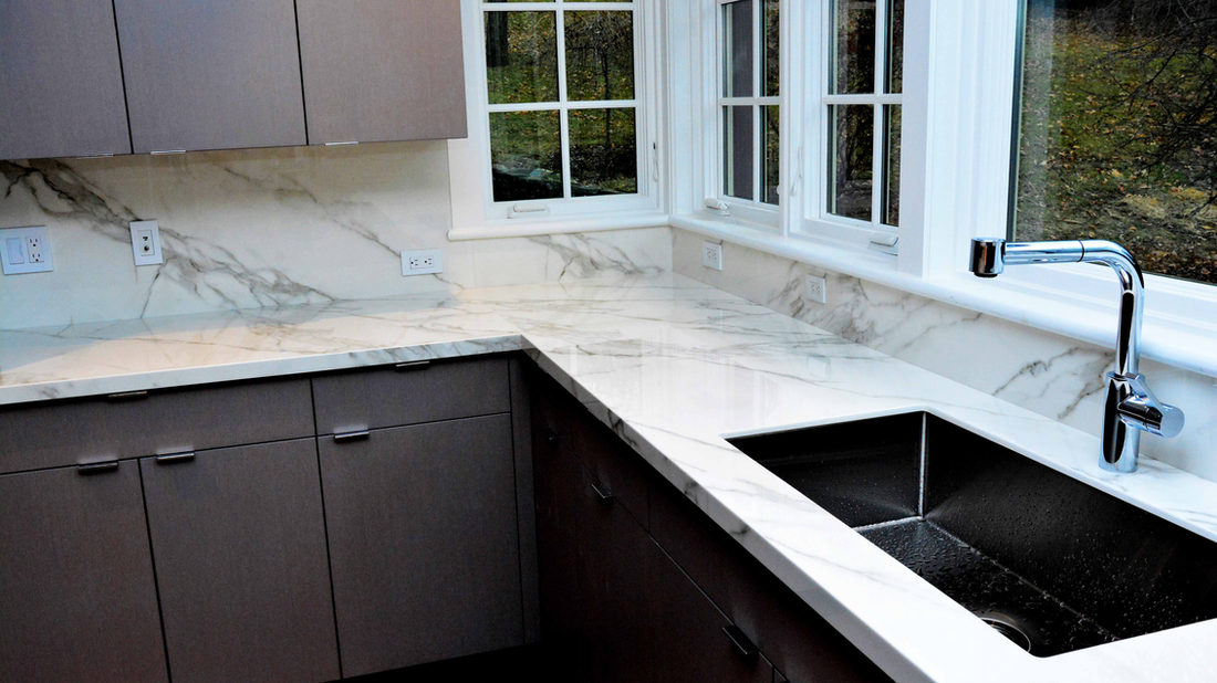 Porcelain countertop installed along a window run in a Connecticut kitchen by Pistritto Marble