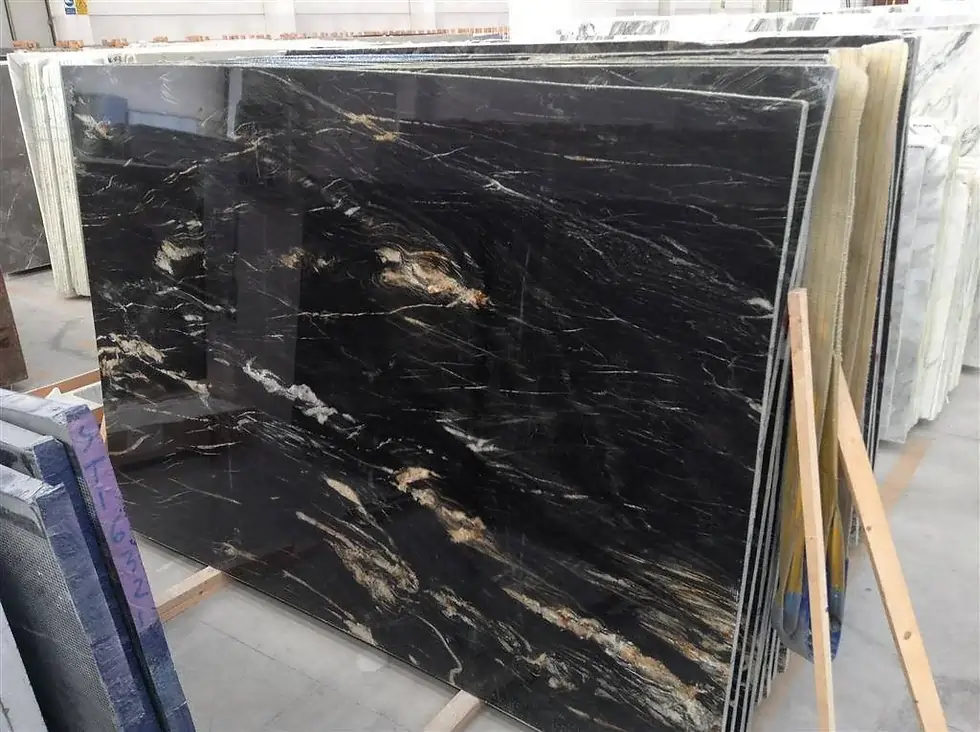 Belvedere polished quartzite slabs, black with gold veining, at the Pistritto Marble store