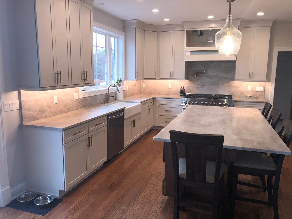 Dark quartzite island installed in a white Connecticut kitchen by Pistritto Marble