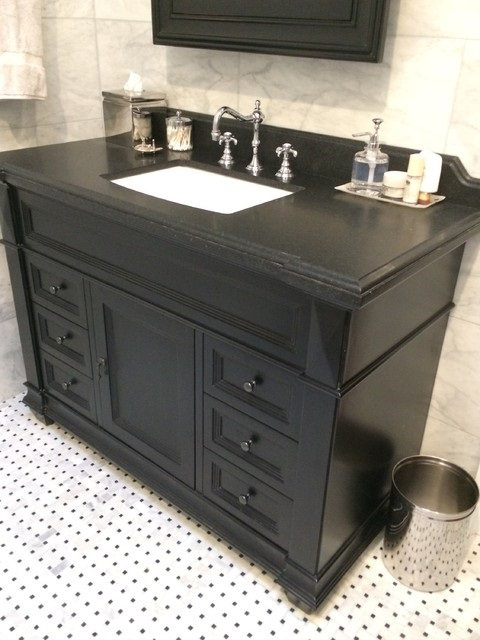 Dark stone vanity with a smooth honed finish, fabricated by Pistritto Marble